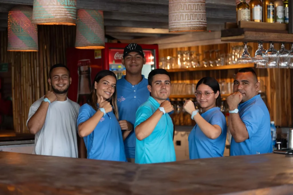 Hostel staff showing SoCashless NFC wristbands